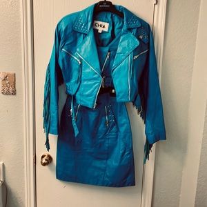 3 piece leather outfit. Turquoise fringe crop biker jacket, top and mini skirt.